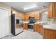 Kitchen featuring stainless steel appliances and natural wood cabinets at 350 Spring View Ct, Dallas, GA 30157
