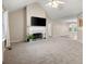 Bright living room featuring a fireplace, high ceilings, and neutral carpet at 350 Spring View Ct, Dallas, GA 30157