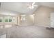 Open-concept living room features carpet, natural light, and versatile layout at 350 Spring View Ct, Dallas, GA 30157