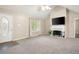 Inviting living room with neutral colors, a cozy fireplace, and lots of natural light at 350 Spring View Ct, Dallas, GA 30157