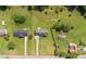 A birds-eye view of the property with a large yard, mature trees and a long driveway at 362 Mcgiboney Rd, Covington, GA 30016