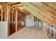 Spacious unfinished attic area featuring exposed wood beams and plywood flooring at 362 Mcgiboney Rd, Covington, GA 30016