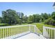 Scenic backyard view from the deck, showcasing the expansive lawn and mature trees at 362 Mcgiboney Rd, Covington, GA 30016