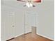 Comfortable bedroom with ceiling fan, hardwood floors, and a closet at 362 Mcgiboney Rd, Covington, GA 30016