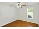 Cozy bedroom featuring hardwood floors, a window, and a ceiling fan at 362 Mcgiboney Rd, Covington, GA 30016