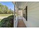 Welcoming front porch of the home with a view of the well manicured lawn at 362 Mcgiboney Rd, Covington, GA 30016