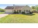 A charming single-Gathering home with a lush green front yard, a two-car garage, and cozy covered porch at 362 Mcgiboney Rd, Covington, GA 30016
