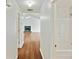 Hallway with hardwood floors leading to a living room and bathroom at 362 Mcgiboney Rd, Covington, GA 30016