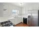 Modern kitchen with stainless steel appliances, white cabinets, and updated countertops at 362 Mcgiboney Rd, Covington, GA 30016