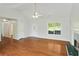 Spacious living room with a fireplace, hardwood floors, and lots of natural light at 362 Mcgiboney Rd, Covington, GA 30016