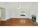 Bright living room features a fireplace and hardwood floors for a cozy, inviting space at 362 Mcgiboney Rd, Covington, GA 30016