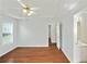 Main bedroom with ceiling fan and hardwood floors, connected to the ensuite bathroom at 362 Mcgiboney Rd, Covington, GA 30016