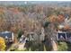 Aerial view of the property showcasing the home's setting among mature trees and landscaping at 760 Woodrow Dr, Lawrenceville, GA 30043