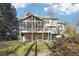 Sprawling backyard with a deck, patio area, and lush landscaping, perfect for outdoor entertaining at 760 Woodrow Dr, Lawrenceville, GA 30043