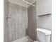 Updated bathroom showcasing patterned tiles and a tiled shower at 760 Woodrow Dr, Lawrenceville, GA 30043