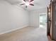 Bedroom offering carpeted floors, neutral paint and access to the kitchen at 760 Woodrow Dr, Lawrenceville, GA 30043