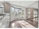Sunlit breakfast nook with hardwood floors, bay window, and access to the outdoors, perfect for casual dining at 760 Woodrow Dr, Lawrenceville, GA 30043