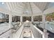 Open-air clubhouse featuring white trim, an upper level, and an view of the community tennis courts at 760 Woodrow Dr, Lawrenceville, GA 30043