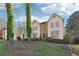 Charming two-story home with a well-manicured lawn and beautiful landscaping, featuring mature trees and shrubbery at 760 Woodrow Dr, Lawrenceville, GA 30043