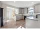 Eat-in kitchen featuring granite countertops, light wood floors and stainless appliances at 760 Woodrow Dr, Lawrenceville, GA 30043