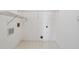 Minimal laundry room featuring white walls and tiled floor at 760 Woodrow Dr, Lawrenceville, GA 30043