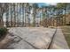Community volleyball court with benches and tall trees in the background at 760 Woodrow Dr, Lawrenceville, GA 30043