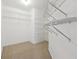Walk-in closet with shelving and carpet floors at 760 Woodrow Dr, Lawrenceville, GA 30043