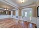 Elegant foyer featuring hardwood floors, decorative molding, and a front door with sidelights at 7804 Gusty Trl, Douglasville, GA 30135