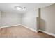 Finished basement with luxury vinyl plank flooring and neutral paint on the walls, offering a spacious and versatile area at 1623 Athens Sw Ave, Atlanta, GA 30310