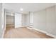Finished basement featuring luxury vinyl plank flooring and access to another living space through a doorway at 1623 Athens Sw Ave, Atlanta, GA 30310