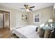Comfortable bedroom with a ceiling fan, closet, window, and modern decor at 1623 Athens Sw Ave, Atlanta, GA 30310