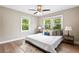 Cozy bedroom featuring two windows and a comfortable queen-size bed with plush pillows at 1623 Athens Sw Ave, Atlanta, GA 30310