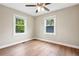 Bright bedroom with two windows, neutral wall color, and hardwood flooring, offering a calming atmosphere at 1623 Athens Sw Ave, Atlanta, GA 30310