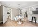 Open dining area with hardwood floors, modern lighting, and access to the kitchen and living spaces at 1623 Athens Sw Ave, Atlanta, GA 30310
