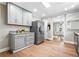 Spacious kitchen with stainless steel refrigerator, granite countertops, and light gray cabinetry at 1623 Athens Sw Ave, Atlanta, GA 30310