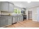 Well-lit kitchen with stainless steel appliances and sleek countertops, offering a modern aesthetic at 1623 Athens Sw Ave, Atlanta, GA 30310