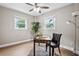Charming office space featuring a ceiling fan, two windows, desk, and modern decor at 1623 Athens Sw Ave, Atlanta, GA 30310