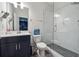 A modern bathroom with a glass shower door, white subway tile, and a vessel sink exudes style at 245 Fairview Cir, Roswell, GA 30076
