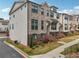Beautiful brick townhome with manicured lawn and landscaping at 245 Fairview Cir, Roswell, GA 30076
