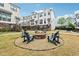 Community fire pit with Adirondack chairs on a gravel bed, perfect for entertaining outdoors at 245 Fairview Cir, Roswell, GA 30076