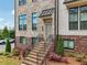 Inviting brick front entrance with elegant black railings at 245 Fairview Cir, Roswell, GA 30076