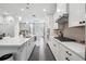 Bright kitchen with quartz counters, stainless steel appliances, and modern backsplash at 245 Fairview Cir, Roswell, GA 30076