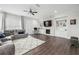 Stylish living room with built-ins, a fireplace, and hardwood floors at 245 Fairview Cir, Roswell, GA 30076