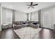 Cozy living room with a large sectional couch and natural light at 245 Fairview Cir, Roswell, GA 30076