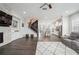Open-concept living area with fireplace, modern finishes, and ample natural light at 245 Fairview Cir, Roswell, GA 30076