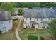 An aerial view of the back of the townhomes with trees surrounding the properties at 2758 Snapfinger Mnr, Decatur, GA 30035