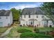The backyard features a grass lawn and a concrete patio with outdoor furniture at 2758 Snapfinger Mnr, Decatur, GA 30035