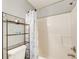 Bright bathroom with a shower/tub combination and a shelving unit for storage at 2758 Snapfinger Mnr, Decatur, GA 30035