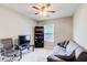 Cozy bedroom with a sofa, a TV, a dark bookcase, neutral walls, and ample natural light at 2758 Snapfinger Mnr, Decatur, GA 30035