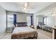 Well lit bedroom featuring carpeted floors, ceiling fan, and large mirrored closet at 2758 Snapfinger Mnr, Decatur, GA 30035